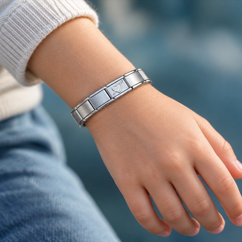 A child wearing a Clarkes Italian charm bracelet
